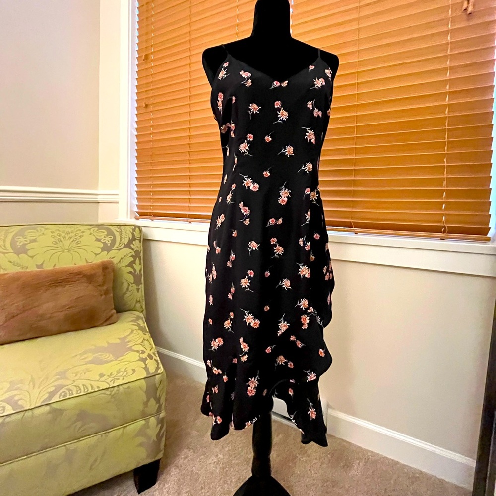 Midi length black dress with small red floral pattern by BB Dakota.